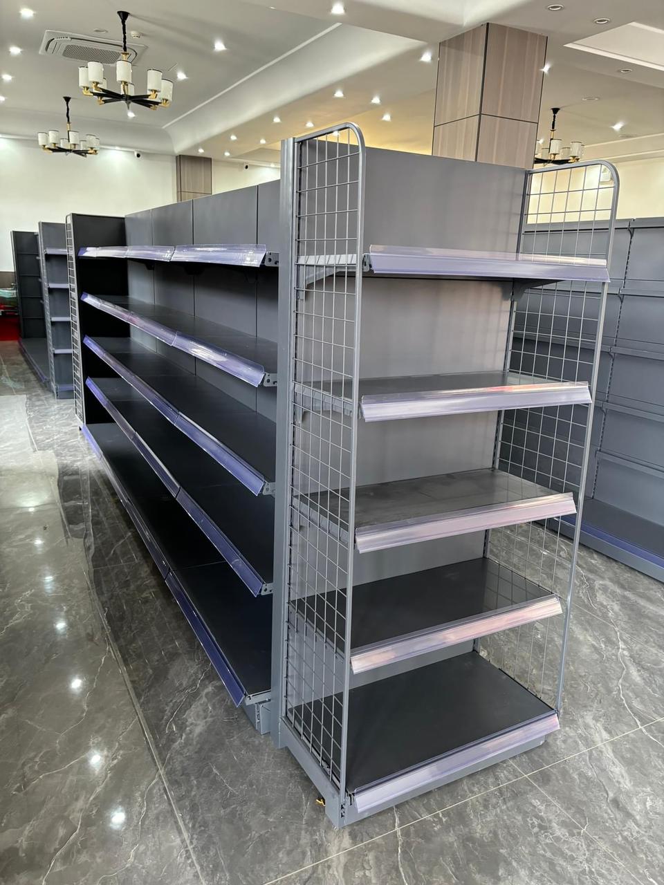 Shop shelving layout showing wall bays and gondola units in a convenience store